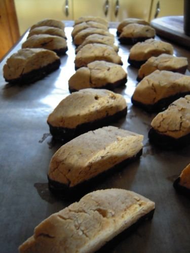 Mmm . . . chocolate dipped biscotti goes great with a cup of coffee in a handmade mug pottery studio open house